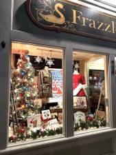 One of the holiday windows of Frazzleberries Country Stores on Main Street.