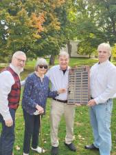 Mayor Michael Newhard, left, accepted the plaque as Marge King-Porter points to 2018-2019 when she and Sue Gardner were selected as Outstanding Community Service winners for their years of local volunteer work. Also shown are Stan Martin and Leo R. Kaytes, co-chairs of Rotary’s Citizen of the Year celebration to be held from 6 to 9 p.m. Wednesday, Oct. 26, at the Landmark Inn