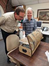 Garrett W. Durland (left) donates an early 19th century trunk on behalf of his family to the Warwick Historical Society. He is pictured with archivist Cathryn Anders. Provided photos.