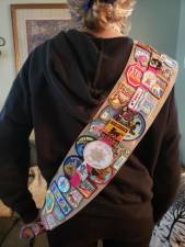 Amber Vitoulis and the impressive sash of badges she’s collected along the years. (Photo provided)