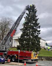 On Monday, Nov. 15, the Warwick Fire Department had its ladder truck out in order for firefighters to put the lights and the star on the Christmas tree on Main Street in front of the First United Presbyterian Church in the Village of Florida. Photo by Terry Reilly.