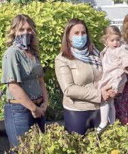 From left, Warwick Relief Market co-founders Nicole McCormick and Carmela Borrazas, with her daughter Penelope. Photo by Roger Gavan.