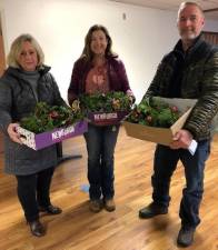 Meals on Wheels of Warwick volunteers Mickey Haglund, Maria Codd-Perez and Kevin Dauwalter with boxes of festive gifts ready for delivery. Photos provided by Debby Briller.