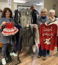 Volunteers Lori Giarratano, Theresa Bernhardsen and Donna Donahue prepare for the Warwick Hope Chest Black Saturday Sale on Nov.27, 10 a.m. to 1 p.m. Photo provided by Elaine Papa.