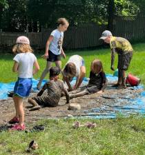 On June 29 - otherwise known as International Mud Day, families from all over Warwick and as far away as Beacon came with their buckets, shovels, mixing bowls, spoons and sticks to experience the fun of mud exploration. Photos provided by Beverly Braxton, Founder of Family Central NY.