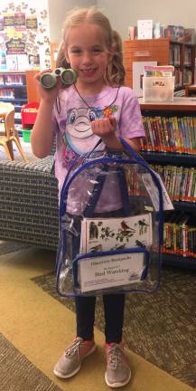 Provided photos Mackensie Sciarra is going to do some birdwatching now that she is outfitted with a Discovery Backpack from the Children's Department at Albert Wisner Public Library.