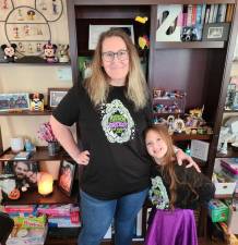 Stephanie Poli-Zilinski, of Andover, NJ, with her daughter. In addition to two other part-time jobs, Poli-Zijlinski recently bought the t-shirt company, Neverland Crew, that her family has patronized for years (pictured). She also homeschools her daughter, now 7.