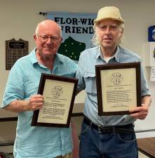 Dr. Richard Hull (left) presenting plaques of appreciation to Gary Randall for the years of service that he and his wife, Kathy, have given to the society and the Village of Florida.