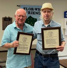 Dr. Richard Hull (left) presenting plaques of appreciation to Gary Randall for the years of service that he and his wife, Kathy, have given to the society and the Village of Florida.