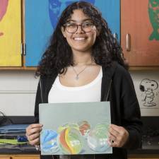 Warwick Valley High School sophomore Olivia Oyola poses for a portrait on April 18. She is the Superintendent’s Artist of the Week. Photo by Tom Bushey/WVSD.