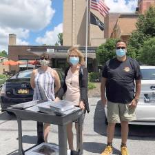 Pictured from left to right are: Daisy Crumm, Crumm Cake Cupcakes &amp; Baked Goods; Donna Matuszewski, St. Anthony’s Community Hospital; and Ruben Estrada, Empanada Master. Photo provided by Tracy Gregoire.