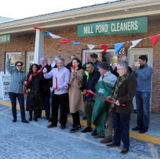 On Thursday, January 27, Town of Warwick Supervisor Michael Sweeton (far right) and members of the Warwick Valley Chamber of Commerce joined owners Steven and Anna Maurer (center) and their staff to celebrate a new Mill Pond Cleaners opening with a ribbon cutting ceremony.