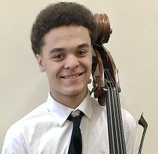 Warwick Valley High School junior Timothy Leonard at school with his bass.