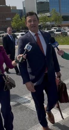 Attorney Thomas Kenniff speaks with reporters outside of Orange County Courthouse Monday, June 2.