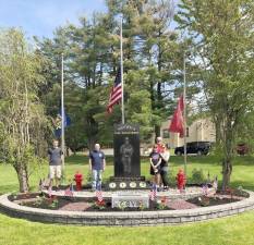 Junior National Honor Society member Hunter Stuart prepared the WFD Monument in Memorial Park with the assistance of Lt. Austin Courtney, firefighter Barry O’Neill and his parents, WFD Paat Captain Steve Stuart with his mom Hope Stuart. Photo provided by Michael Contaxis, 1st Assistant Chief Warwick Fire Department.