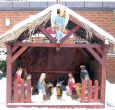 Members of the Warwick Valley Knights of Columbus Council 4952 built this crèche for the Church of St. Stephen, the First Martyr, in 2001. The crib is empty until Christmas Day when the statue of the baby Jesus is placed in it. File photo by Roger Gavan.