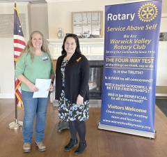 Warwick Valley Rotary Club President Laura Barca, left, presents a $500 donation to Stephanie Molinelli, residential service director for Fearless, the non-profit organization formerly known as Safe Homes of Orange County.