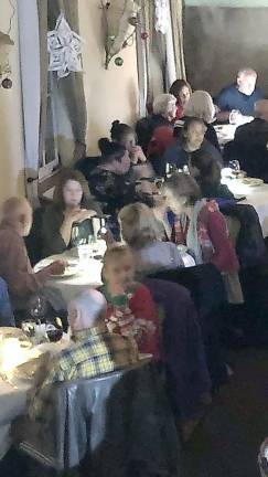 Diners were served at candle lit tables during electric power outage in Warwick Village on Monday evening.