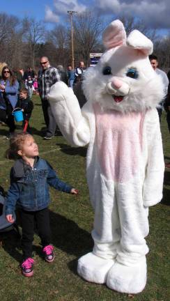 The Easter Bunny was also on hand to greet the children and pose for photos. Jade Geoghan, 4, is thrilled by his visit ad gets ready to give him a big hug (see No. 7)