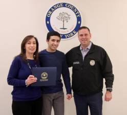 Suzanne Schindler, her son, Andrew Schindler, 22, and Orange County Executive Steven M. Neuhaus.