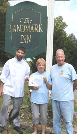 Photo by Roger GavanThe Landmark Inn raised nearly $1,000. From left, Landmark Chef/owner Michael DiMartino, Backpack Snack Attack President Shirley Puett and volunteer Len Singer.