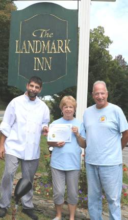Photo by Roger GavanThe Landmark Inn raised nearly $1,000. From left, Landmark Chef/owner Michael DiMartino, Backpack Snack Attack President Shirley Puett and volunteer Len Singer.