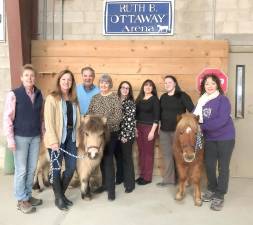 Committee members gather at Winslow Therapeutic Riding Center in Warwick to plan the June 6 “Sunset at Winslow,” a major social and fundraising event open to the public. Last year’s “Sunset” attracted 400 guests and raised $85,500.