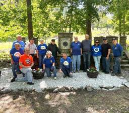Rotary volunteers who helped clean up Warwick Cemetery included, left to right, front row, Stan Martin, Leo R. Kaytes, Tina Buck and John McGloin; back row, Bob Carl, Ed Wiley, Maria Codd-Perez, Tony Cosimano, Mike Eckert, Al Hauser, Melissa Colon, Neil Sinclair and Doug Stage.