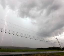 A thunderstorm passing over the Warwick/Pine Island area produced lightning strikes and heavy rain on Tuesday, June 8. Photo by Robert G. Breese.