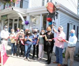 On Wednesday, Sept. 23, Town of Warwick Supervisor Michael Sweeton (left), Warwick Valley Chamber of Commerce President James Mezzetti (right) and chamber members joined owner Rachel Bertoni (cutting ribbon), local artists, associates and customers to celebrate the 20th anniversary of Bertoni Gallery with a traditional ribbon-cutting.