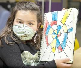 Artist of the Week Brynn Hasbrouk with her Mondrian drawing of a spider web at Park Avenue Elementary School. Photo provided by the Warwick Valley School District.