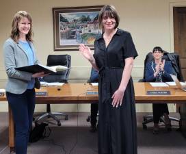 Village of Warwick Clerk Raina Abramson (from left) swears-in Mary Collura as trustee while Trustee Carly Foster looks on. Photo provided by Jennifer O'Connor.