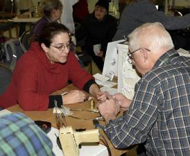 The Repair Cafe helps to reduce waste by allowing community members to come together to fix items for free.