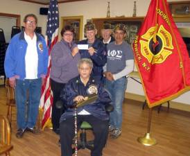 Pictured, beginning in front, is: VFW Trustee Rosemary Decker; and standing, from left to right, are: Joe Lawler, VFW member, Melissa Stevens, Fire Department president, Donald P. Grenier, VFW chaplain, Evarist LeMay, VFW information officer, and Ed Avila, VFW judge advocate. Provided photo.