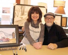 Acclaimed folk artist Billy Jacobs poses with Frazzleberries’ founder Marybeth Schlichting, herself a self-taught folk artist and painter.