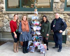 The Greenwood Lake kindergarten team helped stock this “giving tree” with winter gear for those in need.