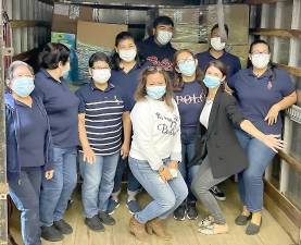 Donors Mari Santana (center) and her team from Ralph Lauren Polo store at Woodbury Common Premium Outlets. Provided photo.