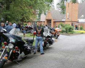 Although there were cloudy skies and occasional light rain, a large group of bikers participated in the ninth annual motorcycle blessing. Photos by Roger Gavan