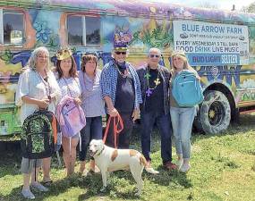 The 2021 Mardi Gras for a Cause Planning Committee from left, Mary Schweitzer, Jennifer Price, Kathy Olinger, Don Oriolo, John Desibia, Tina Bohen Guerrera with mascot “Penny Lane.”