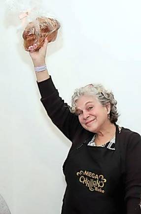 Anita Reich of Monroe is excited that she won a Challah at Chabad’s Mega Challah Bake with Chana Burston at the Rushmore Estate Ballroom
