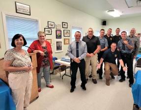 Pictured (from left) are: Marie Sisti, president of the Warwick Valley Seniors; Judy Quackenbush, member of the Warwick Valley Seniors; Chief John Rader; 1st Sgt. Alton Morley; Sgt. Brian Luthin; Det. Mike Hoffman; Officer Stephen Pascal (kneeling); Sgt. Keith Slesinski; Officer Kyle Smith; and Det. Shawn Tetzlaff.