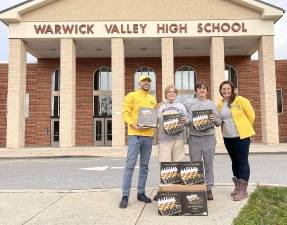 Left to right: Tamer Mohamed, president of Warwick Lions club, Matt Sansone and Joey Finn, who started the new club, and Lion Erin Anderson