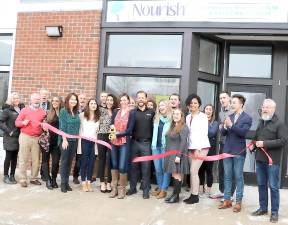 On March 6, Mayor Michael Newhard (far right) and members of the Warwick Valley Chamber of Commerce joined Founder and CEO Jessica Sullivan, her husband Dr. Justin Sullivan, (center), staff and associates to celebrate the first year anniversary of Nourish Your Mind at 2 Overlook Drive in the Village of Warwick.