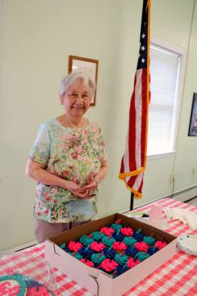 Lydia Amader is about to serve cakes for her 90th birthday celebration at The Warwick Valley Seniors Club. Photo by Roger Gavan