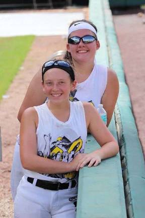 Front, Jayne Celano, second base, and West Milford's Courtney Cienki, pitcher, took a break at the USSSA World Series in Orlando.