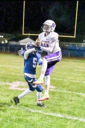 Ryan McLaughlin hauls in one of his 10 receptions vs Valley Central in 33 – 20 win Friday in Montgomery.