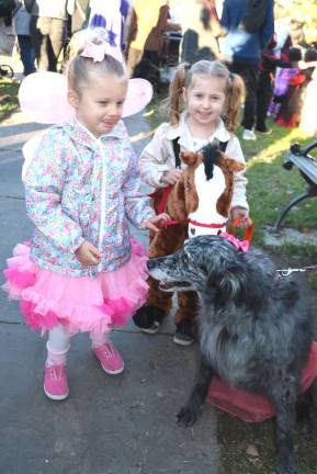 Good friends from left, Brooke Moran and Addie Summerfield, both 3, with &quot;Skye,&quot; an Australian Sheep Dog.