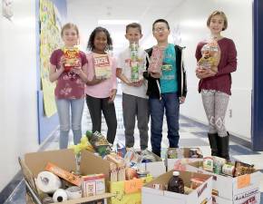 Golden Hill Elementary fifth-graders Sierra Grove, Olivia Perez, AIden Caldwell, Felix You and Kathleen Conlon were among the members of the school's Junior Wellness and Youth Ending Hunger teams involved in a community-wide effort to collect food items for the Thanksgiving holiday. In addition to 27 Thanksgiving dinner baskets, donations gave a boost to the Backpack Snack Attack, an outreach program that provides supplemental nutrition to students when school is not in session.