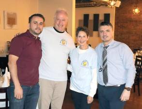 The Backpack Snack Attack Program will hold a dinner and fund raiser at Grappa Ristorante on Monday, Dec. 9. Backpack Snack Attack volunteers Len Singer and Arlene Neiman helped plan the event with Grappa Ristorante owner Tony Sylaj (left) and business partner Nick Ahmetaj (right).