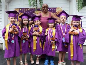 Love Grows Child Care graduates Angelie Costello, Blake Dempster, Connor Dillon, Lukas Pihlava, Natalie Rogers and Roman Rodriguez with owner Cecelia Cenot.